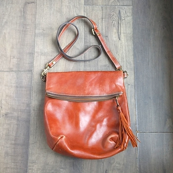 PATRICIA NASH DISTRESSED LEATHER TASSLED CROSSBODY 12LX12W.